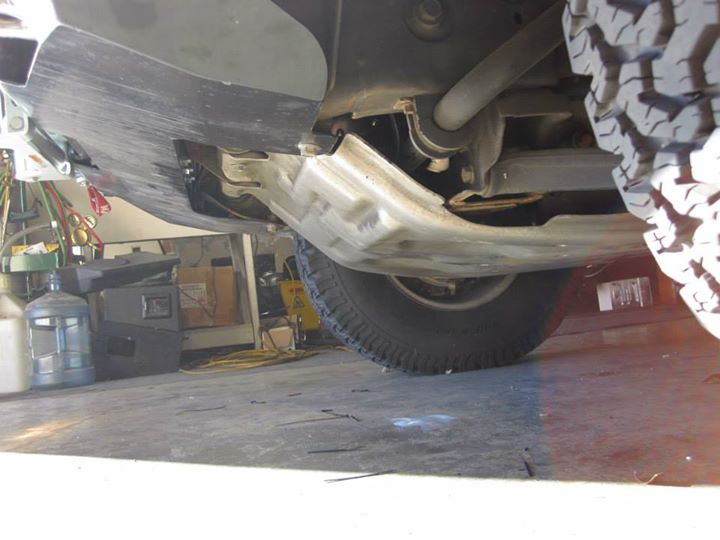 Trumpets are both above the factory skid plate. If you look real close you can just see it between the skid and swaybar.